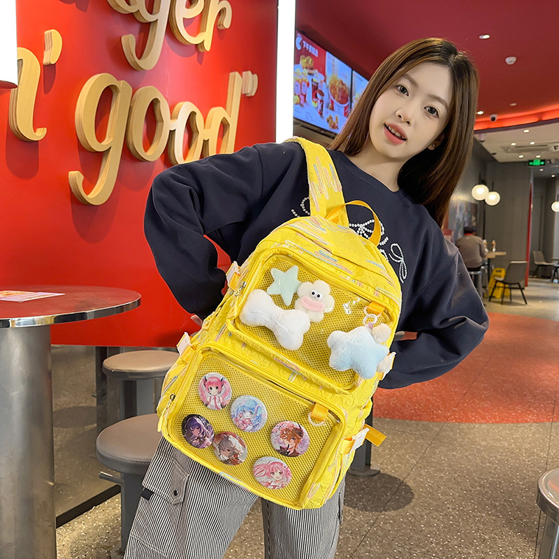 En la nueva mochila femenina 2025, la nueva chica tiene una gran capacidad de dibujos animados, estudiantes de secundaria, mochilas llenas de bolsos portátiles.