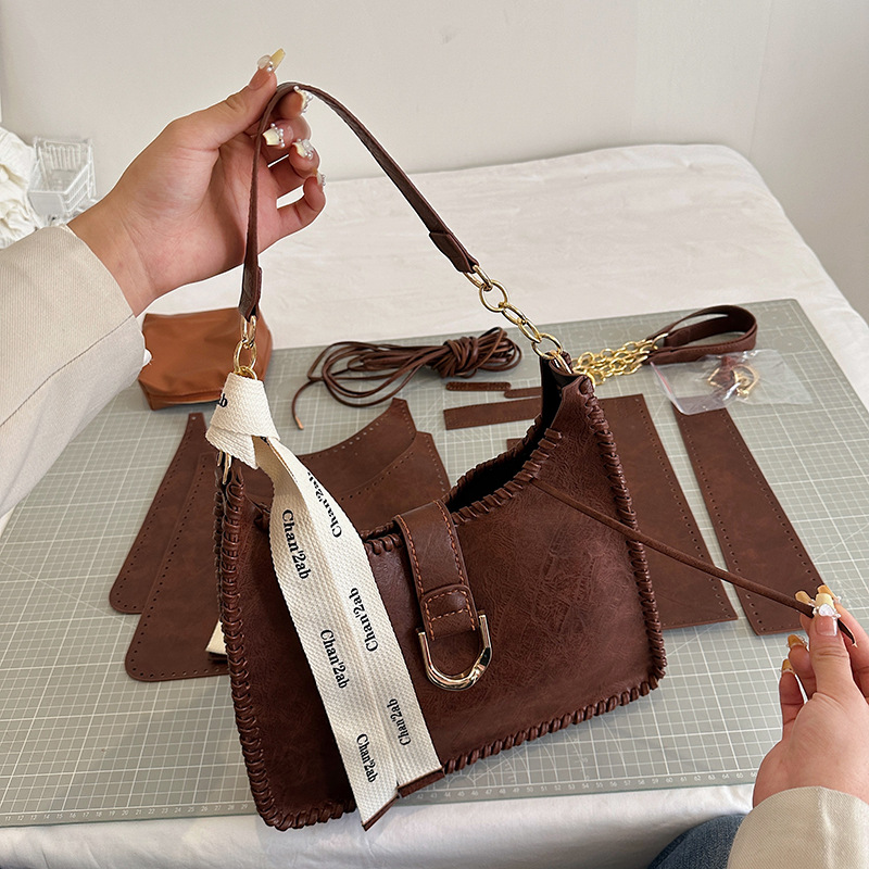 Bolsa de material de estilo británico bolsa de axilas de Superficie suave DIY hecho a mano tejida bolso diseño sentido no colisión solo bolso de hombro