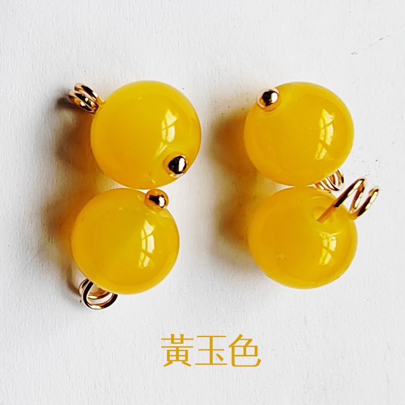 翠玉の唐装の吊り玉をまねて黄玉のシャツの装飾品をまねてチャイナドレスの漢服のボタンのカラー玉の部品の卸売りを掛けます。|undefined