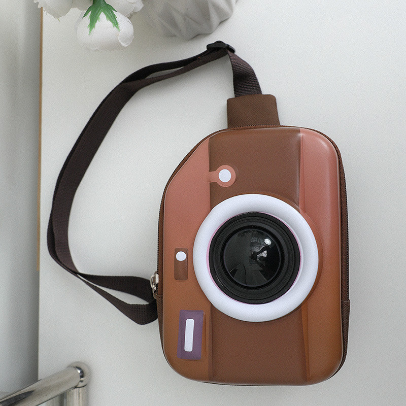 Bolso infantil bolso de cámara de dibujos animados 2025 nuevo bolso estereoscópico de pecho para niños puede brillar nuevo bolso de niña