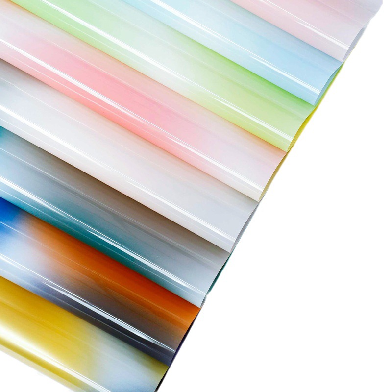 Gradiente de color celofán al por mayor fantasía caramelo flor papel de embalaje impermeable OPP cristal papel de embalaje translúcido