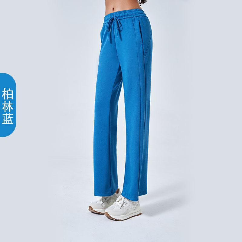 Otoño y invierno nuevo aire de algodón suelto pantalones deportivos simples de mujer cuerda delgada pantalones de yoga de doble bolsillo