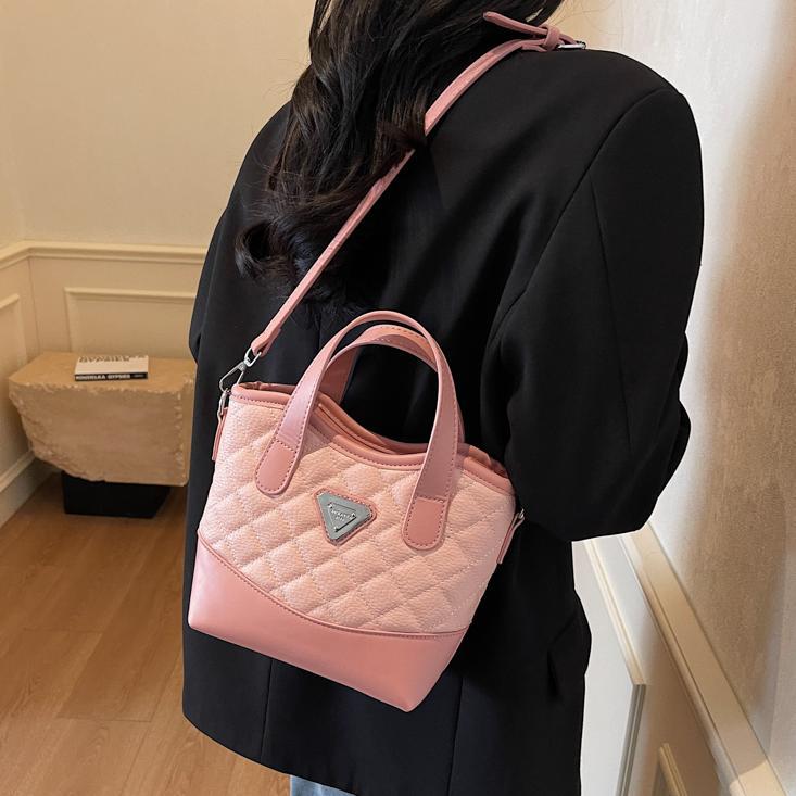 Bolso de mano de alta sensación lingue versátil para mujeres 2025, nuevo color extranjero, bolso de hombro, bolso de cubo de explosión