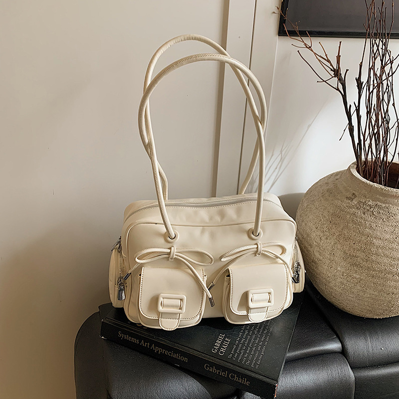Bolsa de brazo coreana de arco de gran capacidad de moda extranjera bolso de hombro de viaje diario bolso de nicho de diseño