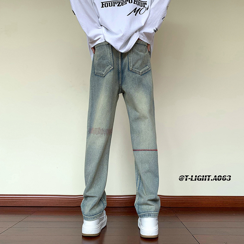 Nuevo producto Trend American White Retro Bordado Scratch Old Jeans Pantalones sueltos Hombres y mujeres Trendy Long