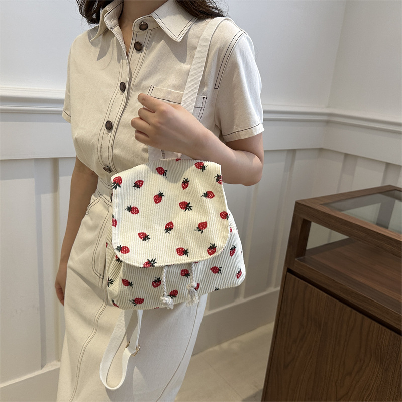 2025 nuevo estilo simple bolso de tramo inclinado de moda bolso de tela de fibra de fibra bolso de aire extranjero bolso de hombro de viajes de cadena casual de mujer