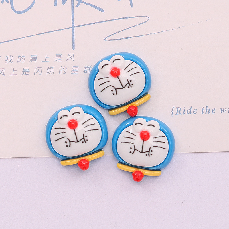 Dibujos animados lindo Jingdang gato expresión DIY caja del teléfono accesorios para el cabello crema pegamento material hecho a mano accesorios de resina al por mayor