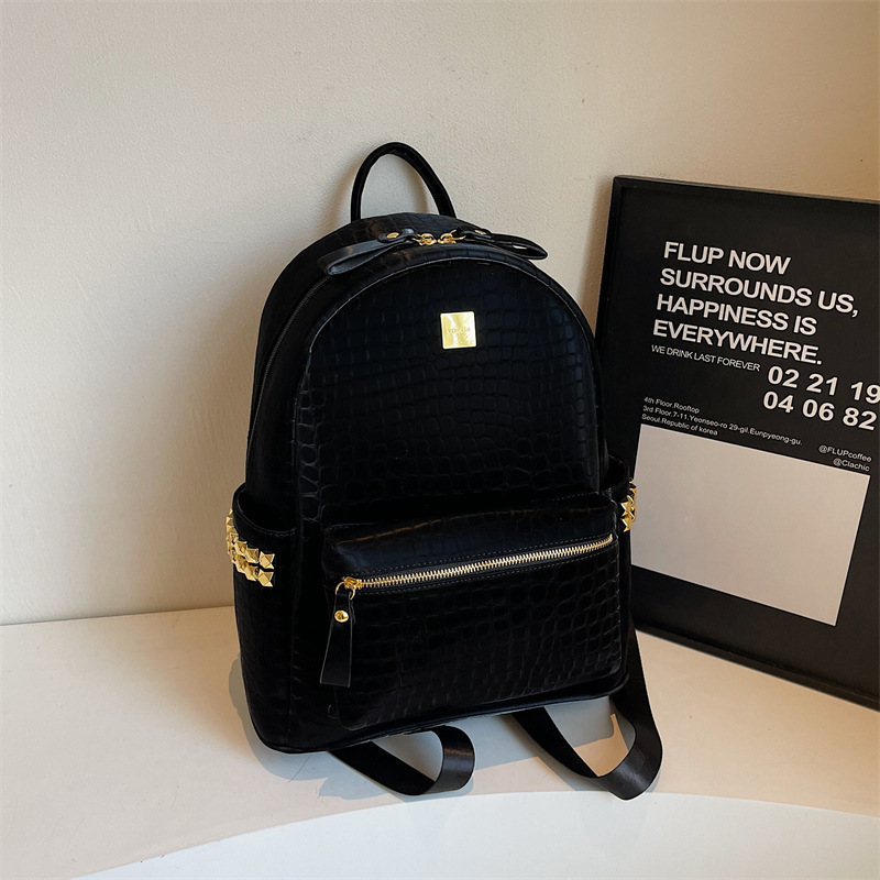 Mochila de viajes de gran capacidad de aire extranjero 2025 nueva mochila de mujer transfronteriza popular mochila de estudiantes universitarios con patrón de piedra