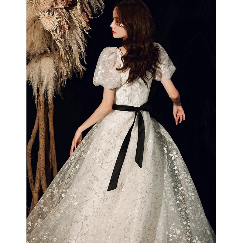 Vestido de noche para banquete, nuevo estilo 2026, blanco, estilo francés, elegante, de hada, largo, con falda abullonada, para fiesta anual.