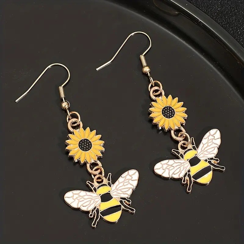 Suxin transfronterizo Europa y América de venta caliente personalidad de dibujos animados pendientes de abeja simple aleación goteo de aceite margarita flores pendientes para mujeres