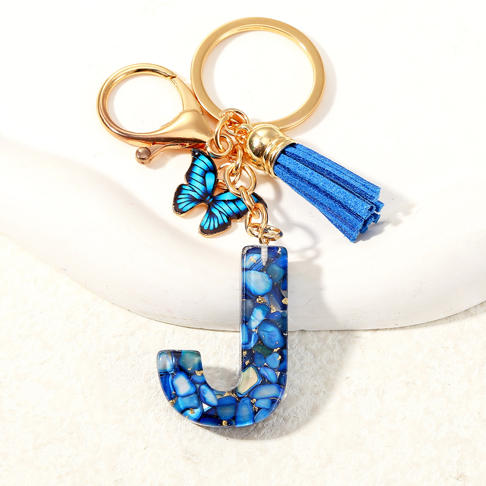 Nuevo transfronterizo mariposa 26 letras inglesas de cristal goteo llavero bolsos accesorios colgante de automóviles