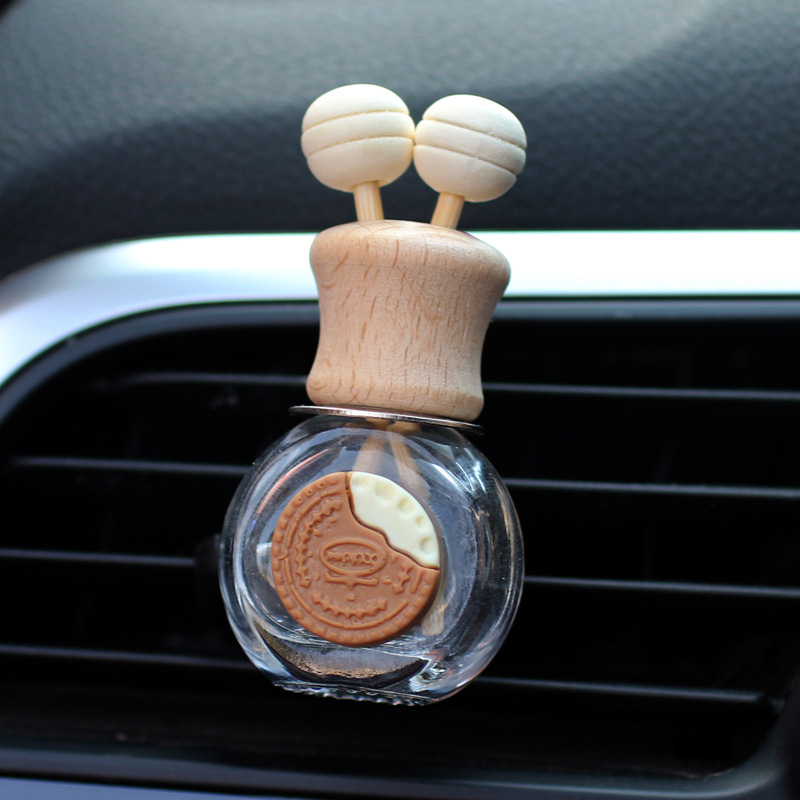 Salida de aire de perfume de coche, dibujos animados, celebridad de Internet, botella de aromaterapia de coche, clip de aire acondicionado, accesorios de coche, bowknot tembloroso