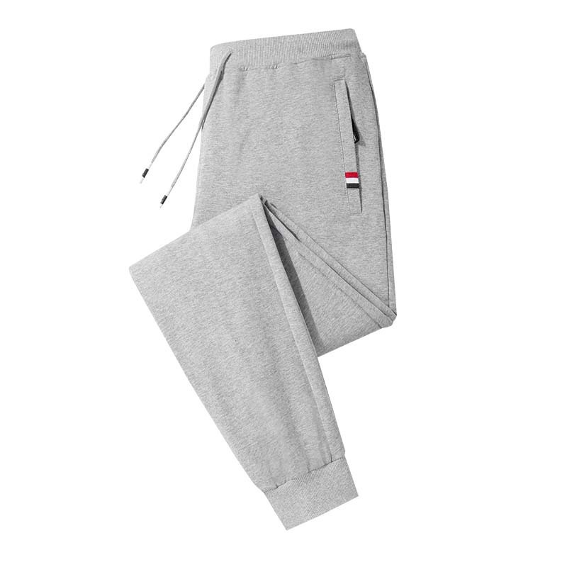 Primavera y otoño Mediados de cintura de color sólido casual juvenil algodón gris alto elástico sin cinturón pantalones sueltos ajustados Pantalones deportivos atados al tobillo