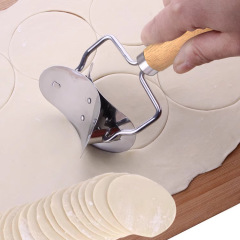 ギョーザの皮の神器の実用家庭用の台所の専用の餃子の木の柄のメーカーは直接販売して現物を代行します。