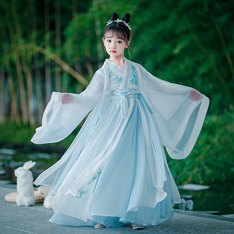 Hanfu style girl with fairy-tale like ancient Chinese dress, summer attire with Chinese elements, children's outfit inspired by Tang dynasty, little girl in traditional Chinese style summer dress