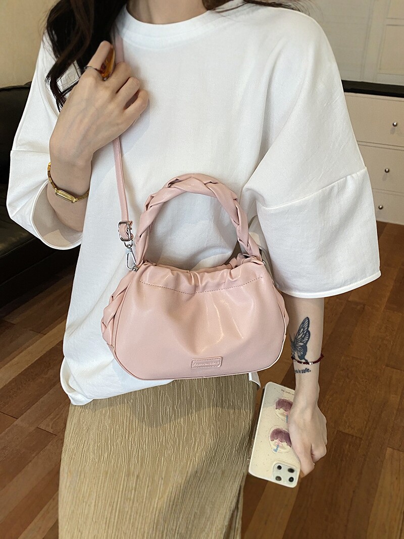 Corea del Sur nueva bolsa de mano plegada mujer 2026 primavera nicho versátil bolso de mochila simple de moda bolsa de nube de viaje