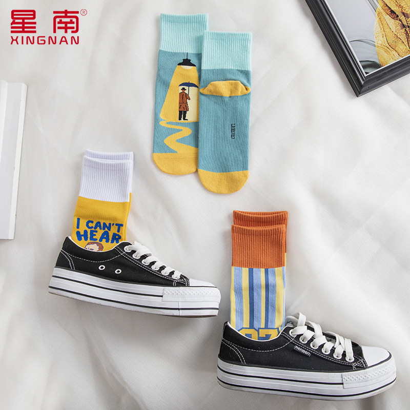 Xingnan autumn and winter New Four Seasons socks in the tube cartoon stitching Xinjiang cotton color street fashion women's socks manufacturers wholesale