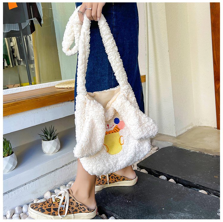 This autumn and winter hand-held bag with big ears, cute animal-embroidered fur, and a simple lambskin large-capacity student backpack undefined