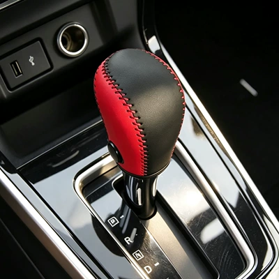 Also includes a handbrake cover and a — Sürətlər qutusu və əl tormozu başlıqları
