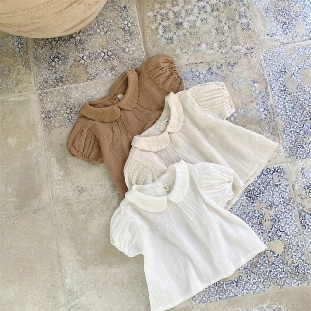 Versión coreana de la nueva niña de verano, linda solapa, camisa de bebé de manga corta, camiseta, top de manga corta para bebés, dulce y versátil