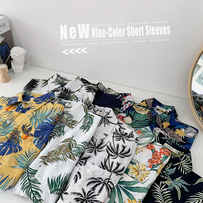 Estilo retro de Hong Kong Ruan guapo camisa de seda de hielo abrigo ropa de los hombres Hawaii playa floral camisa de manga corta de los hombres sueltos más tamaño