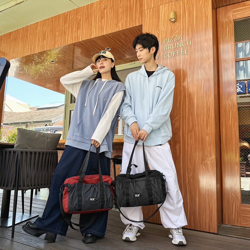 Shake sonido Marvel Tini al aire libre simple estilo de mochila de gran capacidad para hombres y mujeres de color contraste nicho de diseño de tendencia