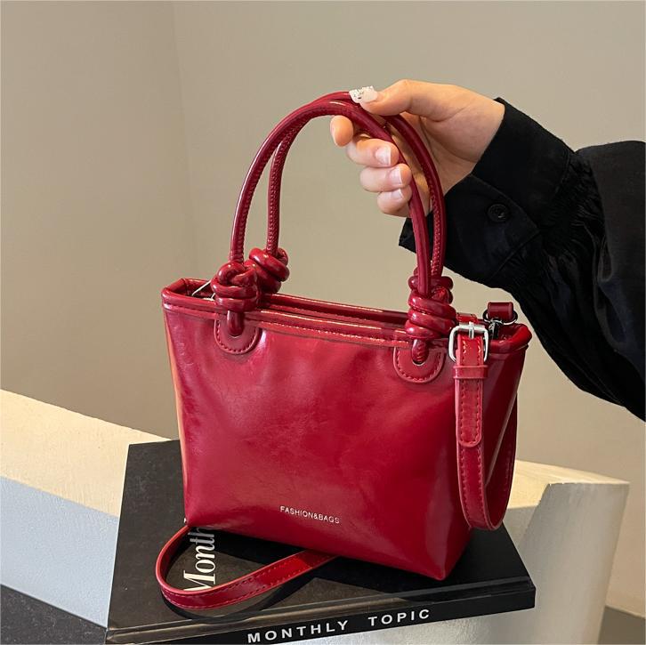 Moda nicho bolso de cubo de mano para mujeres 2024 nuevo estilo coreano simple bolso de hombro de diseño de alto nivel bolso de mochila