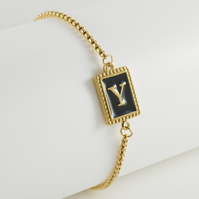 La moda europea y americana transfronteriza del acero inoxidable 26 pulsera inglesa de la letra en relieve pulsera Titanium de la cremallera del acero 18K de la frontera para las mujeres