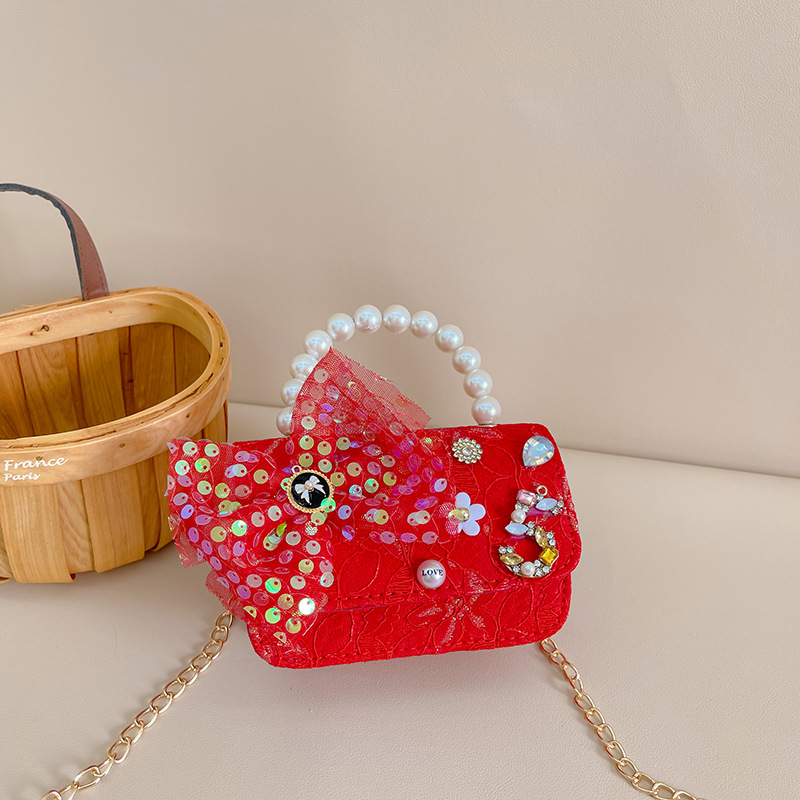 Primavera y verano nueva celebridad en línea bolso de los niños moda Chanel estilo princesa bolsa pequeña niña linda bolsa de mensajero portátil al por mayor