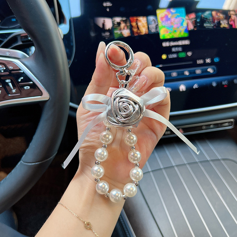 Cuero pu pequeño rosa llavero perla arco flores coreana llavero de automóvil bolso colgante bolso para mujeres