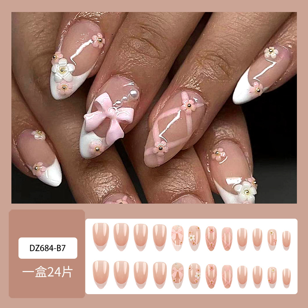 Uñas postizas estilo Hot Girl con borde blanco, puntas de uñas con lazo de alta gama, uñas postizas almendradas más vendidas transfronterizas.