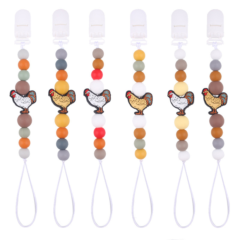 Nuevos bebés y niños series de dibujos animados gallo calmar la cadena de tetas bebés de silicona perlas de goma de dientes de mordida de dientes de mordida de dientes anti-caída cadena