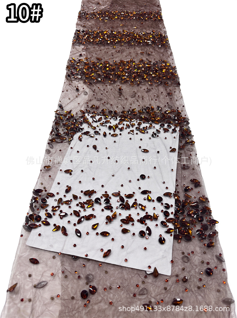 Tejido de malla de diamante de gota de agua laminada mano pesada clavos taladro de cola de pescado vestido de noche tela de boda en stock