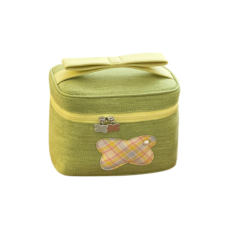 Bolsa de maquillaje portátil de gran capacidad 2025 nuevo lindo bolso de almacenamiento de arco de alta calidad bolso de lavado de viaje