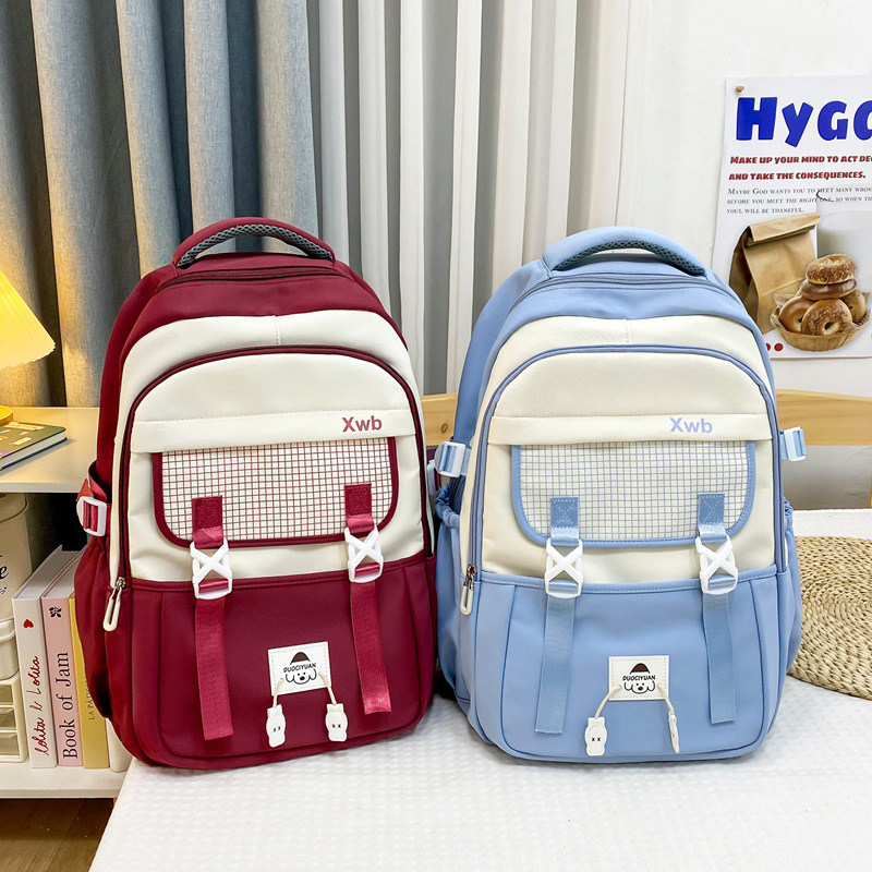 Al por mayor 2025 nuevos estudiantes de primaria de secundaria masculinos mochila de escolares de escolares de alta niñas mochila de viaje de gran capacidad