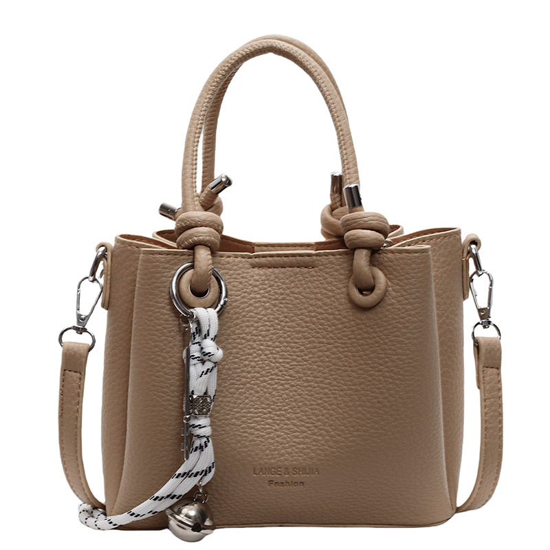 Simple bolso de cubo de mano extranjero 2025 nuevo bolso de mujer, bolso de hombro casual, sensación de alto nivel, bolso de mochila super caliente