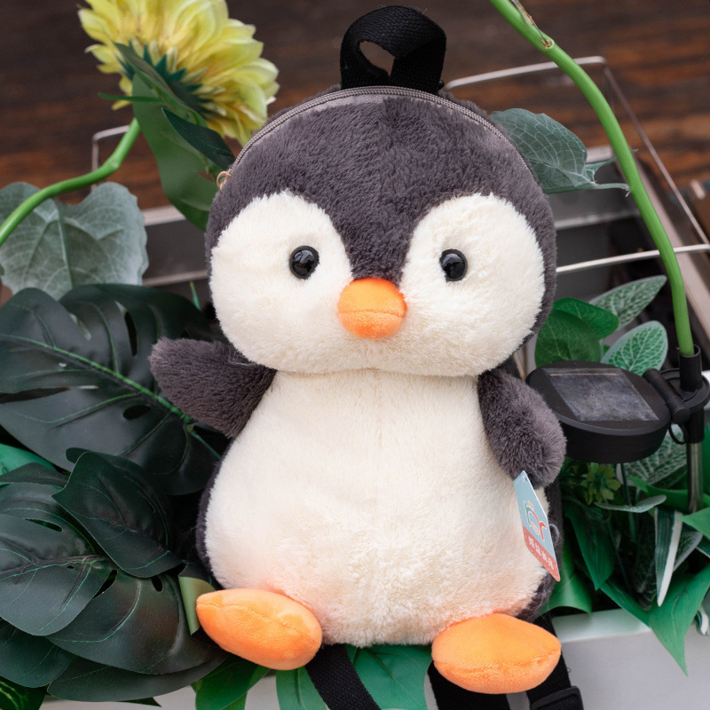 Nuevo creativo lindo invierno muñeca pingüino mochila muñeca de dibujos animados pingüino muñeca de niños almohada agarrar muñeca lote