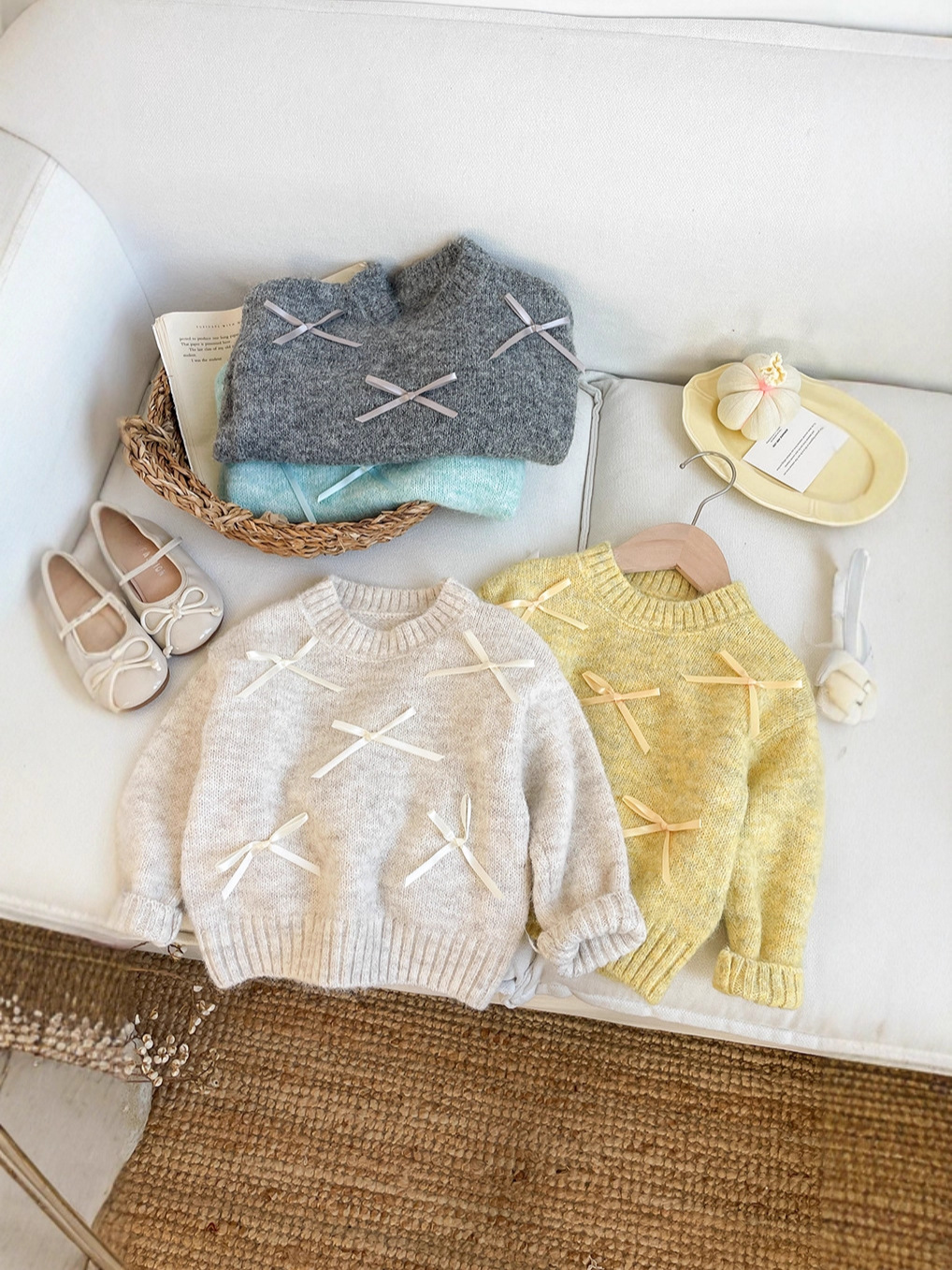 Autumn children's knitted sweater with bow