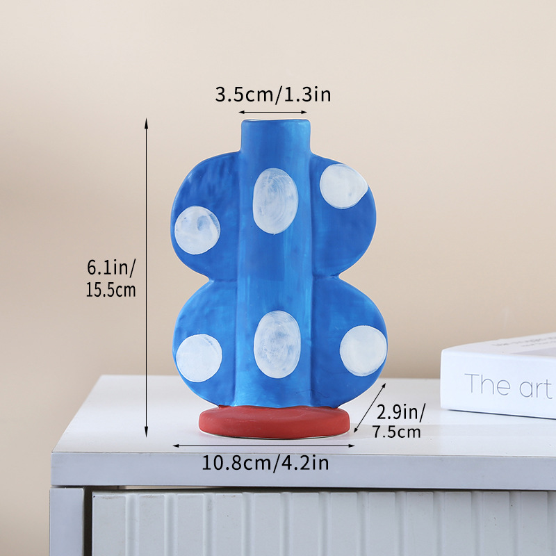 나비 병 - 흰색 점이 있는 파란색 배경