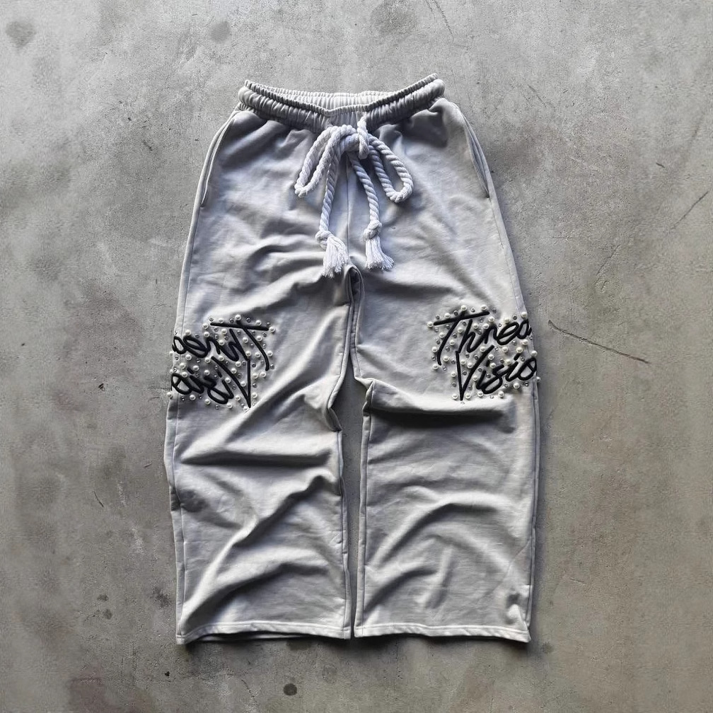 Pantalones sueltos bordados con cuentas bordados de la industria pesada retro de la calle alta europea y americana transfronteriza para hombres y mujeres pantalones casuales de pierna ancha hiphop