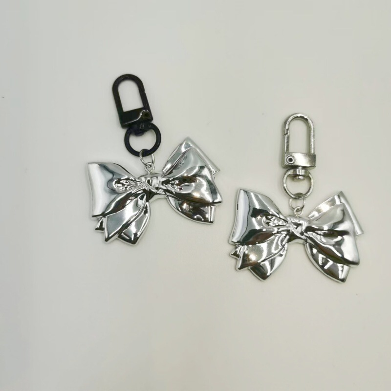 Light Luxury High-end Sense silver Bow Keychain Resin Silver Plated Niche Creative Bag Headset Case Accessories Pendant