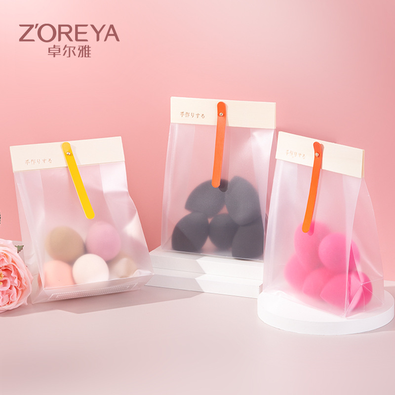 Zhuoerya nuevo producto maquillaje huevo esponja soplo maquillaje herramientas de belleza bolsa color sólido maquillaje huevo al por mayor maquillaje conjunto de huevos