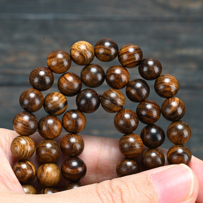 アフリカの黒い花梨のホノルルの木の手の串は海南の黄色の花梨の仏珠の装飾品のブレスレットに似ています。|undefined