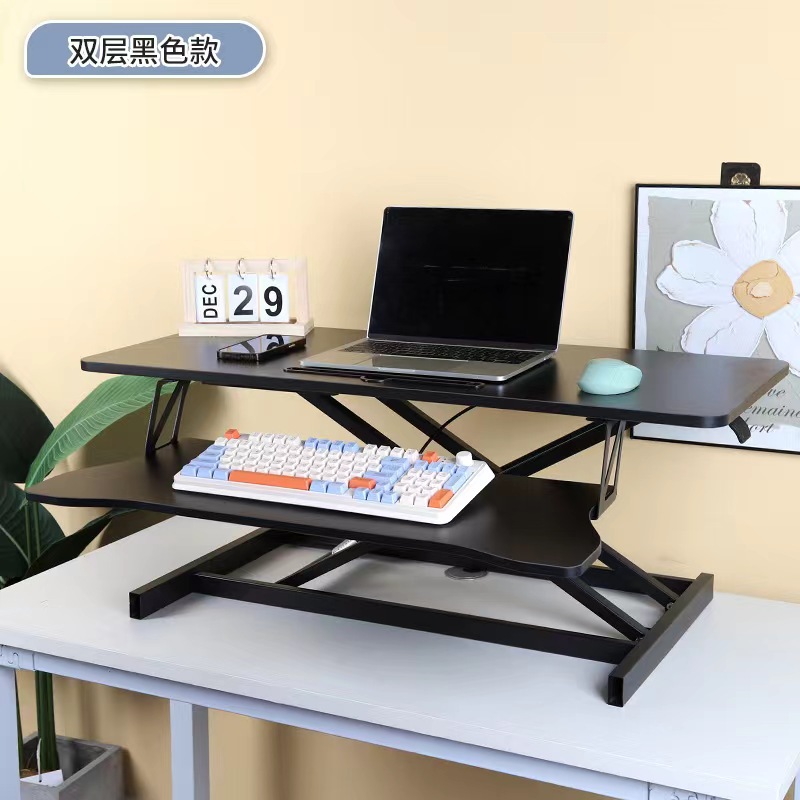 気動机の上のコンピュータの机は立式の事務室の台の上に立って高くなるノートの折り畳みの机で机を昇降することができます。
