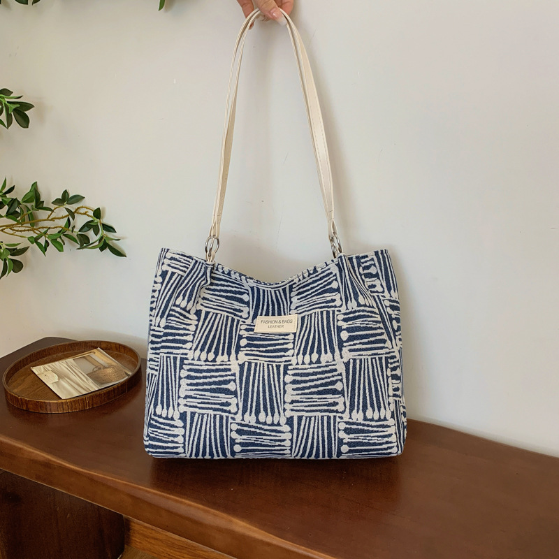 Bolsa multipropósito coreana de hombro de mujer, nicho de diseño de textura portátil, bolso de hombro de mujer, pequeño bolso fresco.