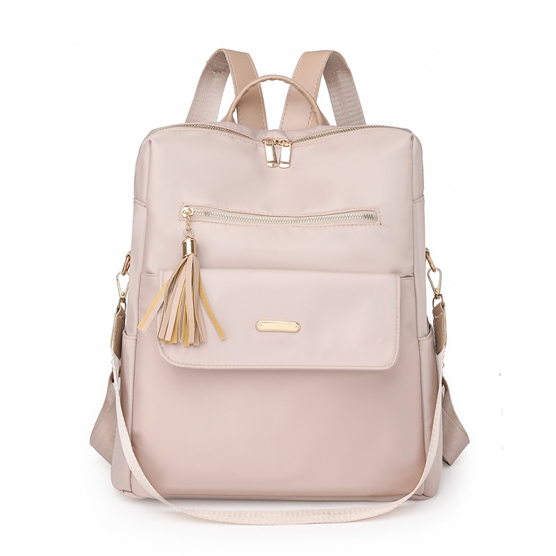 Fábrica al por mayor 2023 nueva versión coreana de la mochila de nailon para mujer moda literaria color de contraste viaje mochila de doble uso marea