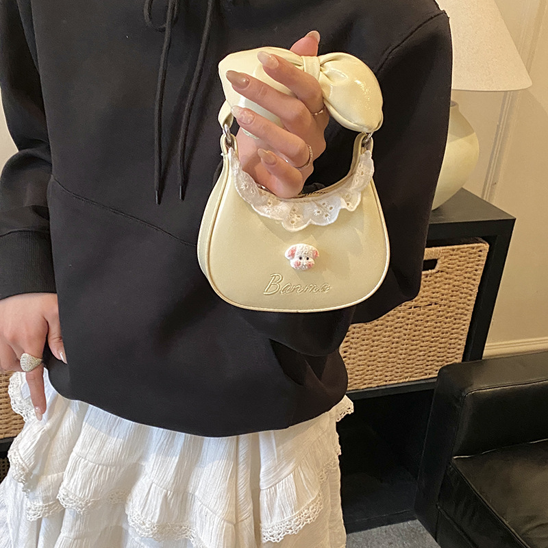 Bolsa de hombro de niñas de encaje dulce bolso de arco lindo 2026 nuevo mini bolso de accesorios para niños