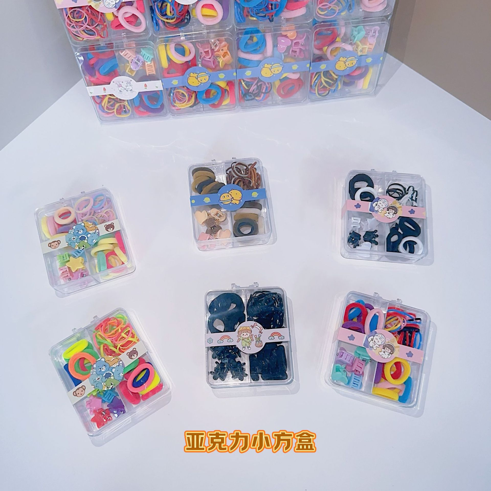 Al por mayor 2.5 pulgadas pulgar pequeño anillo de cabello nuevo niño no lesiones de cabello correa de color caja de chaqueta de cabello pequeña personalidad encantadora