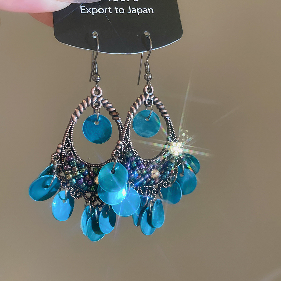 Pendientes de borla de concha geométrica redonda, estilo de vacaciones junto al mar, gancho para la oreja, pendientes de todo fósforo de moda, sentido de clase alta de nicho