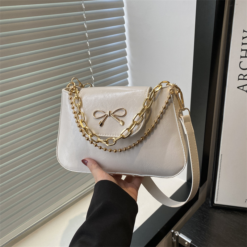 2025 nuevo estilo de color sólido tendencia primavera casual bowknot cadena de mujer axila de un solo hombro bandolera mujer